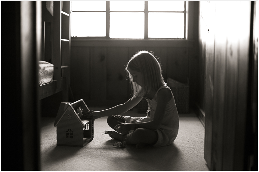 A child enjoys quiet playtime at a lakeside cottage in Michigan