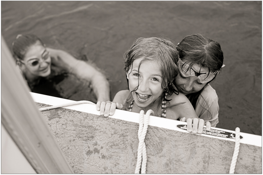 Three children play in a Michigan lake